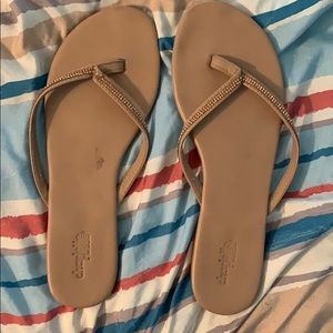 Tan sparkle flip flops